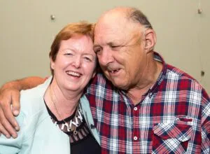 Two people smiling together